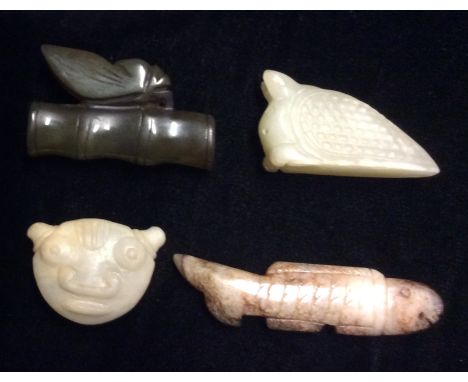 A COLLECTION OF ORIENTAL JADE CARVINGS  Including a beatle sat on a bamboo branch, an armadillo of triangular form, a stylize