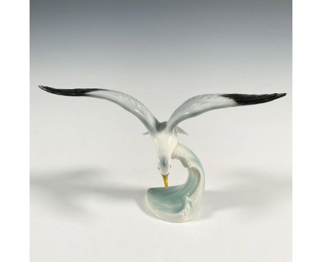A hand painted figure of a seagull over a wave. Goebel marked. Issued: 20th centuryDimensions: 8.75"L x 3.75"W x 5"HManufactu