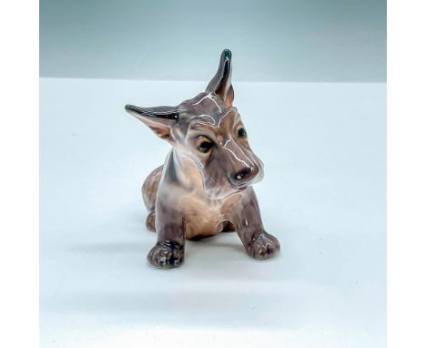 This Scottish Terrier pup figurine in all dark brown, features a gentle and sweet expression. DJ Copenhagen backstamp. Issued