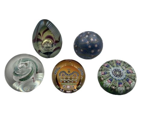 Five paperweights comprising; Okra 'Amethyst' limited edition no. 39/500 another Okra paperweight, both by Richard P. Golding