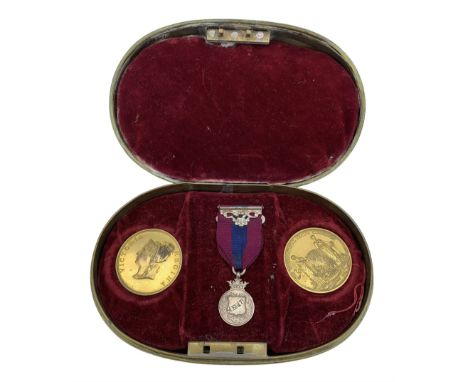 Early 19th century oval brass box with hinged cover, the velvet lined interior containing Victorian gilt electrotypes, two le