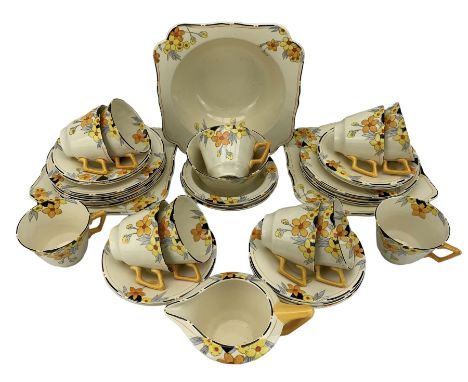 Crown Ducal Sunburst pattern Art Deco tea set comprising eleven cups, twelve saucers, twelve plates, milk fug, sugar bowl, se