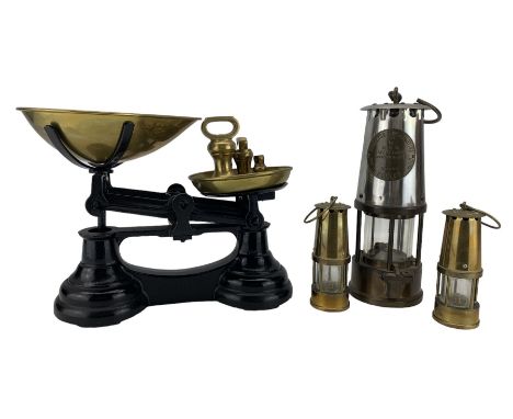 Miners safety lamp by Protector Lamp and Lighting Co., Eccles, pair of miniature brass miners lamps and a set of kitchen scal