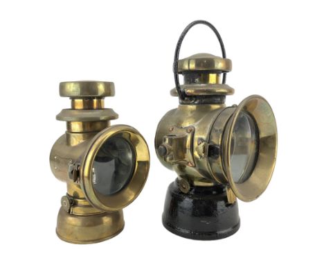 Lucas 'King of the Road' brass lamp, no. F141, and another by Lucas, with black painted swing handle and base, H32cm (2)