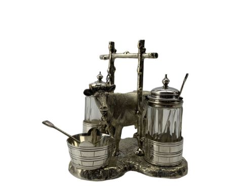 Victorian silver plated novelty cruet by Thomas Wilkinson, circa 1883, formed as a dairy cow flanked by two churns supporting