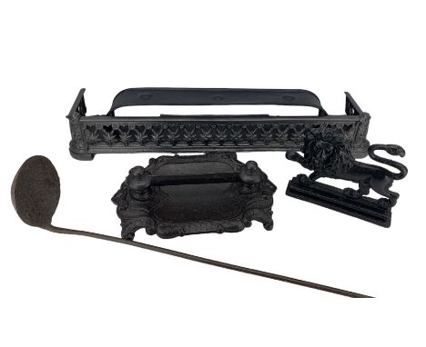 Large cast iron foundry ladle, two cast iron fenders, boot scraper and a fireside lion (5)