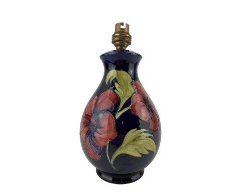 Moorcroft Hibiscus pattern table lamp, on blue ground, H21cm excluding fitting