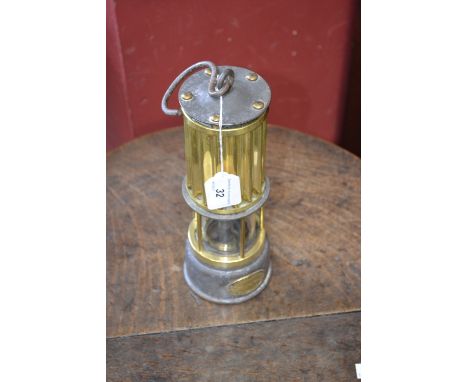 Mining - an early 20th century miner's lamp, by The Automobile Palace, Llandrindon Wells, ribbed brass canopy, glass chamber,