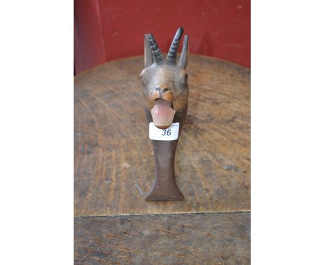 An early 20th century Black Forest nutcracker, carved  with the head of an Alpine Ibex,  21cm high, c.1900