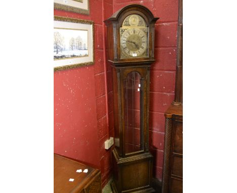 An oak cased longcase clock, arched face, brass spandrels, silvered chapter ring, Roman and Arabic numerals, three weights, (