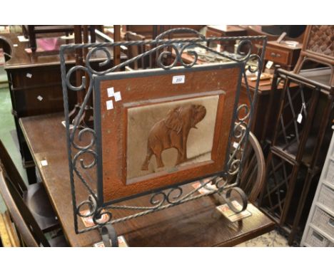 A copper and wrought iron firescreen.