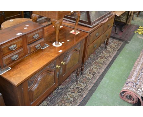 A Victorian mahogany washstand, oversailing top, fielded panel doors, turned legs, ceramic caster; a conforming dressing tabl