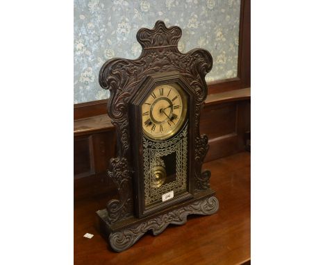 An Art Nouveau American gingerbread clock by Ansonia.