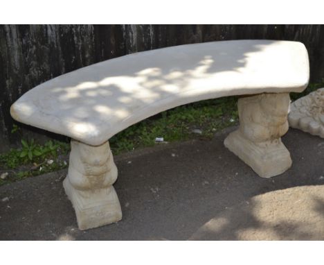 Garden ornaments - a reconstituted stone bench, arced seat, squirrel shaped supports