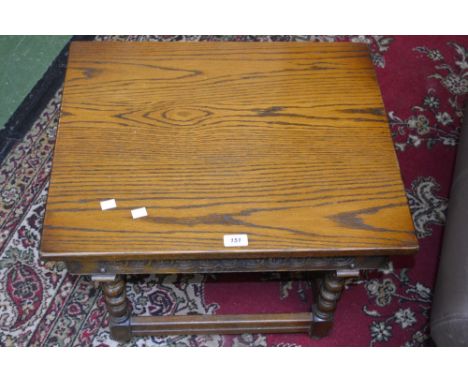 An Old Charm oak occasional table, rectangular top, floral roundels to frieze, bobbin turned legs.