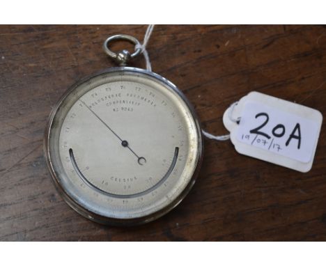 An early 20th century travelling pocket holosteric barometer, 6.5cm register marked out in Celsius, no.9243, 9.5cm over loop 