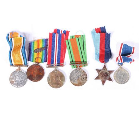 WWI medal pair to MID R W WAINWRIGHT RN (Royal Navy) with mentioned in despatch oak leaf, WWII war medal, defence medal and 1