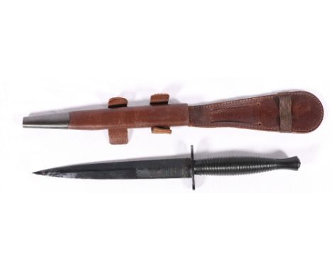 FS fighting knife with blued steel blade etched by Wilkinson Sword, turned grip with leather scabbard and frog. blade length 
