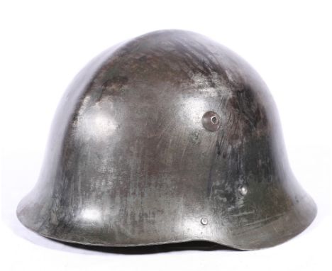 WWII steel helmet with leather liner and chin strap.