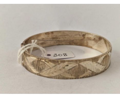 A silver hinged bangle