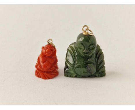 A red coral Buddha pendant and similar nephrite jade Buddha