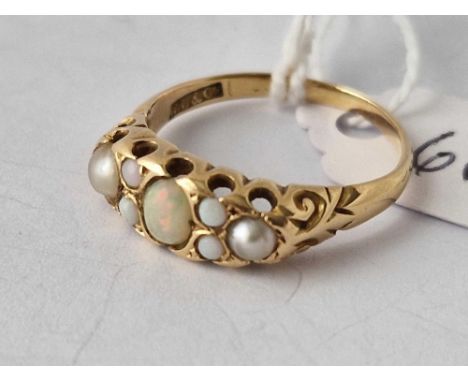 A seven stone opal and pearl ring, 18ct size P, 3.2 g.