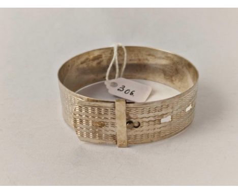 A wide silver buckle bangle