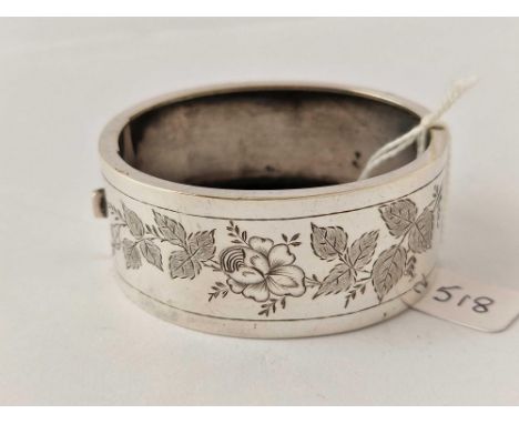 Victorian wide silver bangle with engraved floral decoration