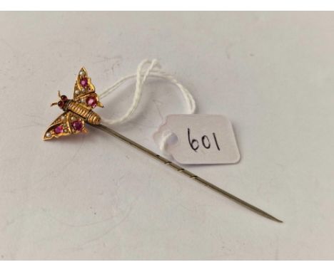 A gold top butterfly stick pin with rubies and pearls