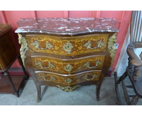 A French Louis XV style rosewood, marquetry inlaid and marble topped bombé commode