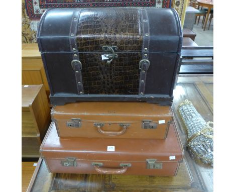 A trunk and two suitcases
