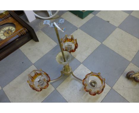A vintage brass and glass chandelier and two hair dryers
