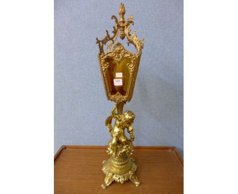 A rococo style gilt metal figural table lamp
