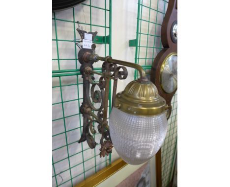 A Victorian Aesthetic Movement wrought iron and brass wall light