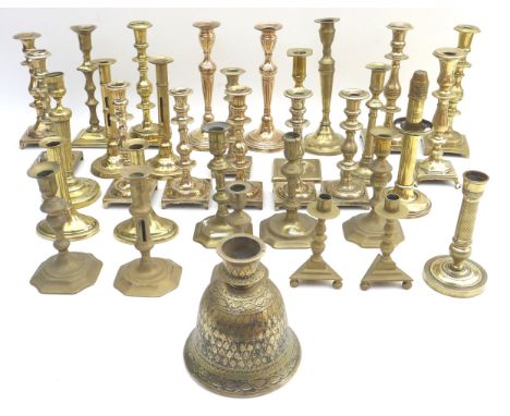 A collection of Georgian/Victorian and later brass candlesticks, many in pairs, including several ejector candlesticks, toget