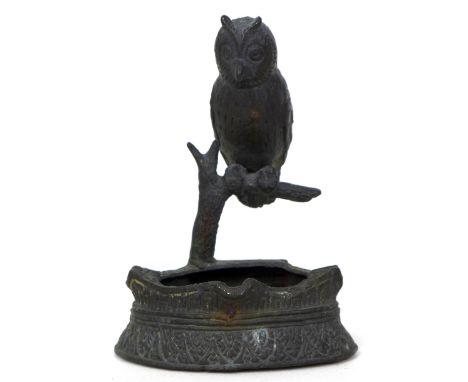 A Russian cast bronze ashtray or brush holder, 19th century, modelled with a long eared owl perched on a branch above the bow