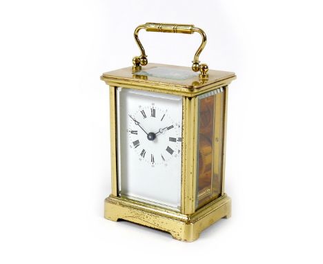 A modern brass carriage clock, with five glass case, the white enamel dial with black Roman numerals, engraved presentation p