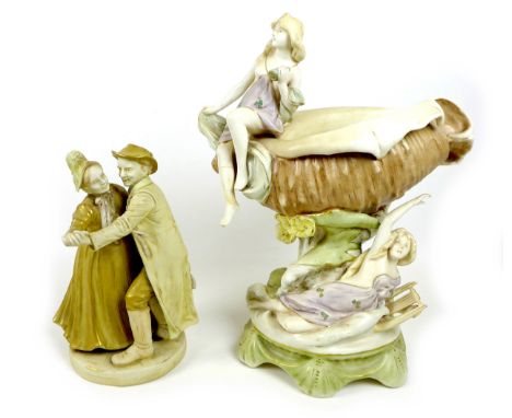 A Dux ceramic centrepiece, formed as a conch shell with two classical ladies draped beside it, a/f damaged and repairs, 43cm 