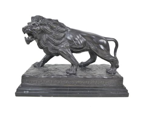After Antoine-Louis Barye: a late 20th century bronze casting of a lion, on naturalistic base with Greek key border, presente