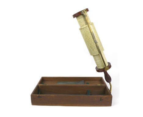 A Fuller's cylindrical slide rule calculator with the printed sliding drum scales, mahogany ends and handle, 43cm long, in fi