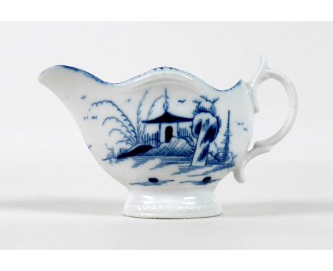 A late 18th century Caughley porcelain miniature milk jug, decorated in underglaze blue with a 'Rock House Island' pattern, c