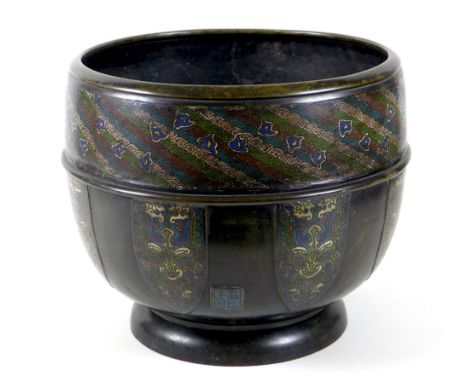 A Chinese or Japanese bronze cloisonne enamel jardiniere, likely 19th century, decorated with a wide band of diagonal fan sha