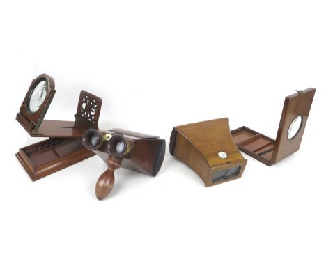 A collection of hand held and table top stereoscopes, including a Victorian Brewster style hand stereoscope by London Stereos