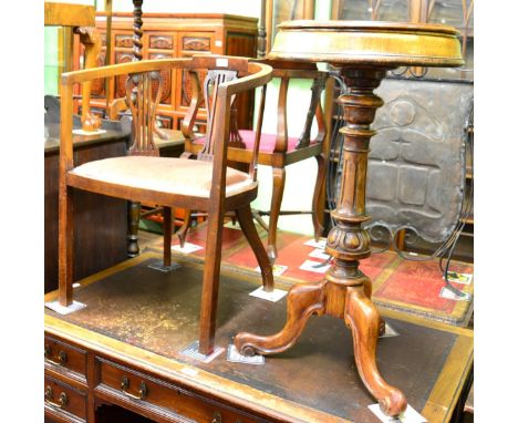 A 19th century walnut tripod table with hinged lids and an Edwardian chair 