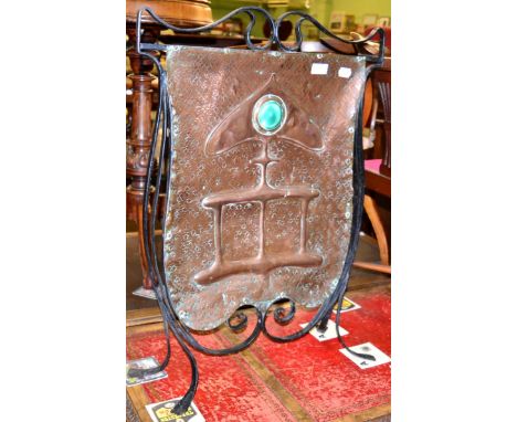 An Arts & Crafts copper and wrought iron fire screen with ruskin type cabochon  