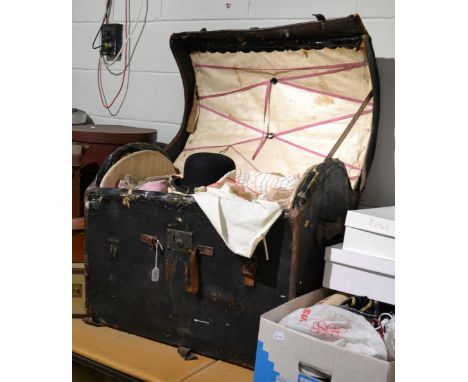 Domed travelling trunk, with internal lift out tray enclosing assorted textiles, costume, bowler hat etc; together with a qua