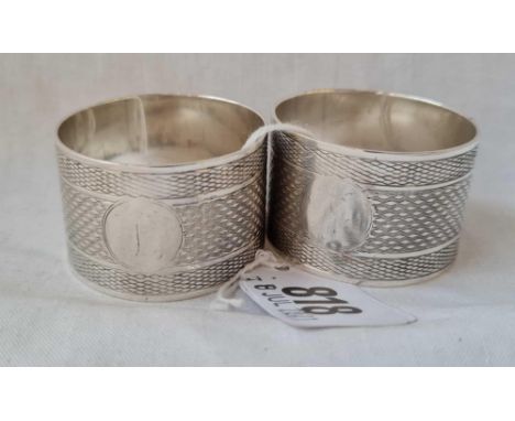 A pair of napkin rings with engine turned decoration Chester 1924 - 76 gms 