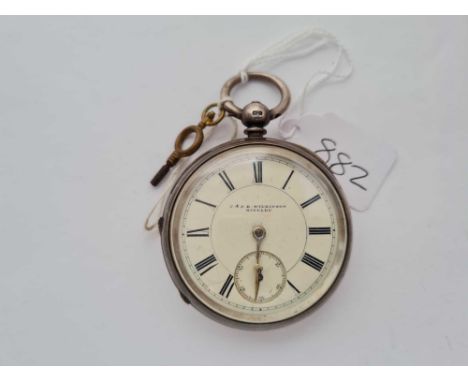 A gents large silver pocket watch and key by J Wilkinson of Bingley with seconds dial 