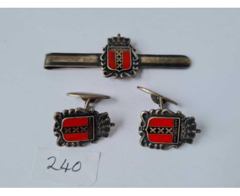 An enamel and metal Amsterdam pin and matching cufflinks 