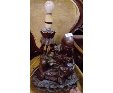 Carved oriental lamp on stand